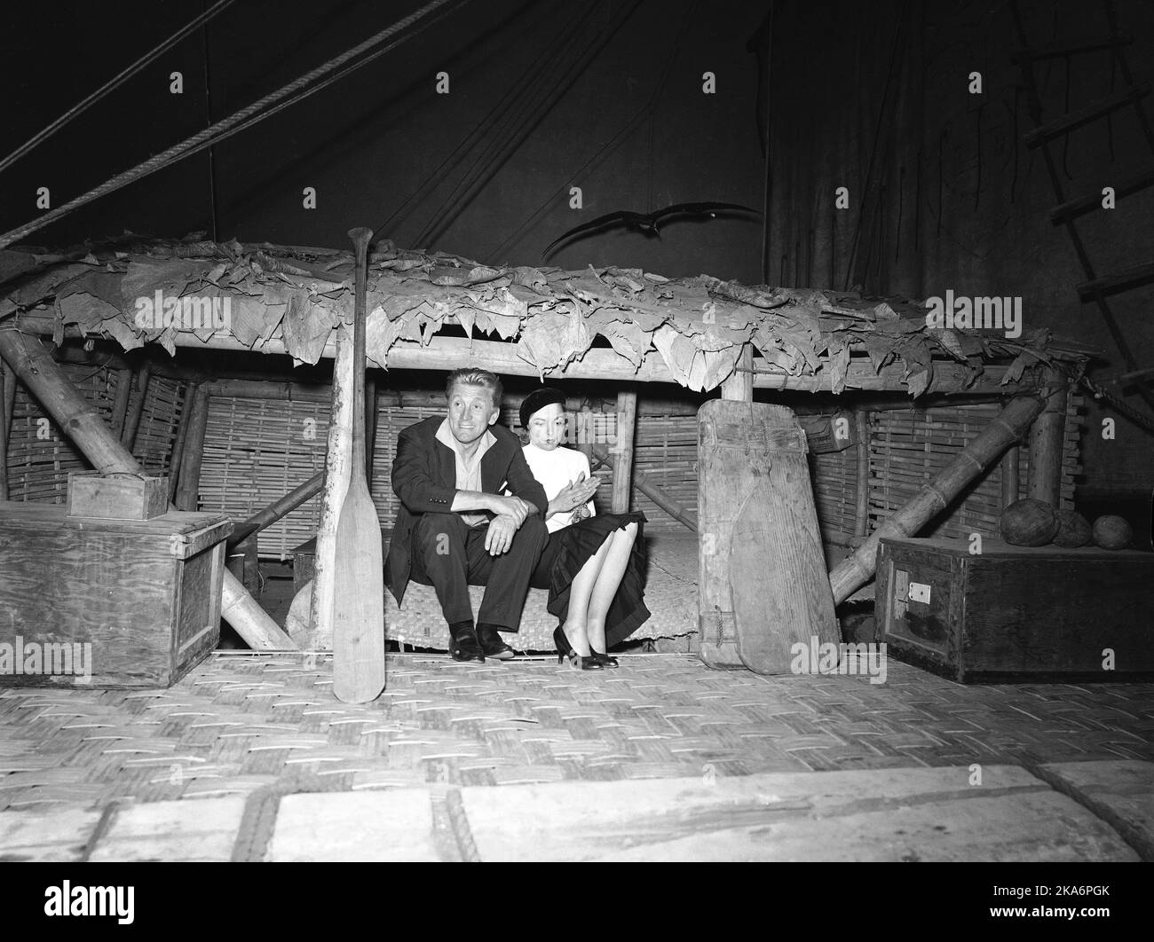 Oslo, Norway on 29 June 1957. Filephoto. The actors Ernest Borgnine, Kirk Douglas, Janet Leigh and Tony Curtis in Oslo before heading to Hardanger to shoot the movie 'The Vikings' by Kirk Douglas. Here Kirk Douglas and Janet Leigh are sitting an the Kontiki raft in the Kon-Tiki Museum. Photo: Aage Storloekken / Aktuell / NTB scanpix Stock Photo