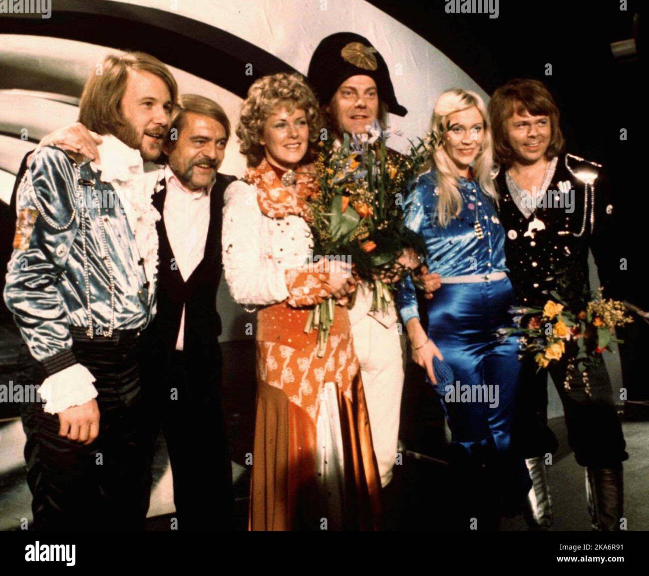 FILE - In this April 6, 1974 file photo, members of Swedish group ABBA and close associates celebrate the victory of their song 'Waterloo' in the Eurovision Song Contest in Brighton, England. The four members of ABBA, Benny Andersson, left, Annifrid Lyngstad, third left, Agnetha Faltskog, second right, and Bjorn Ulvaeus, right, , second right, were the most successful winners of the Eurovision Song Contest, enjoying unprecedented success after their victory. The final of this year's competition takes place on Saturday, May 14 in the Swedish capital Stockholm. (AP Photo/File) Stock Photo