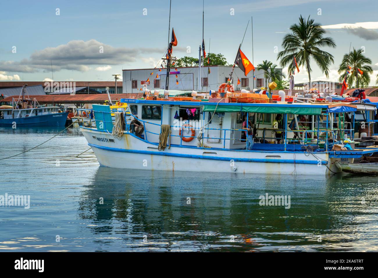 Boats anchored in marina Alotau, Milne Bay Papua New Guinea Stock Photo