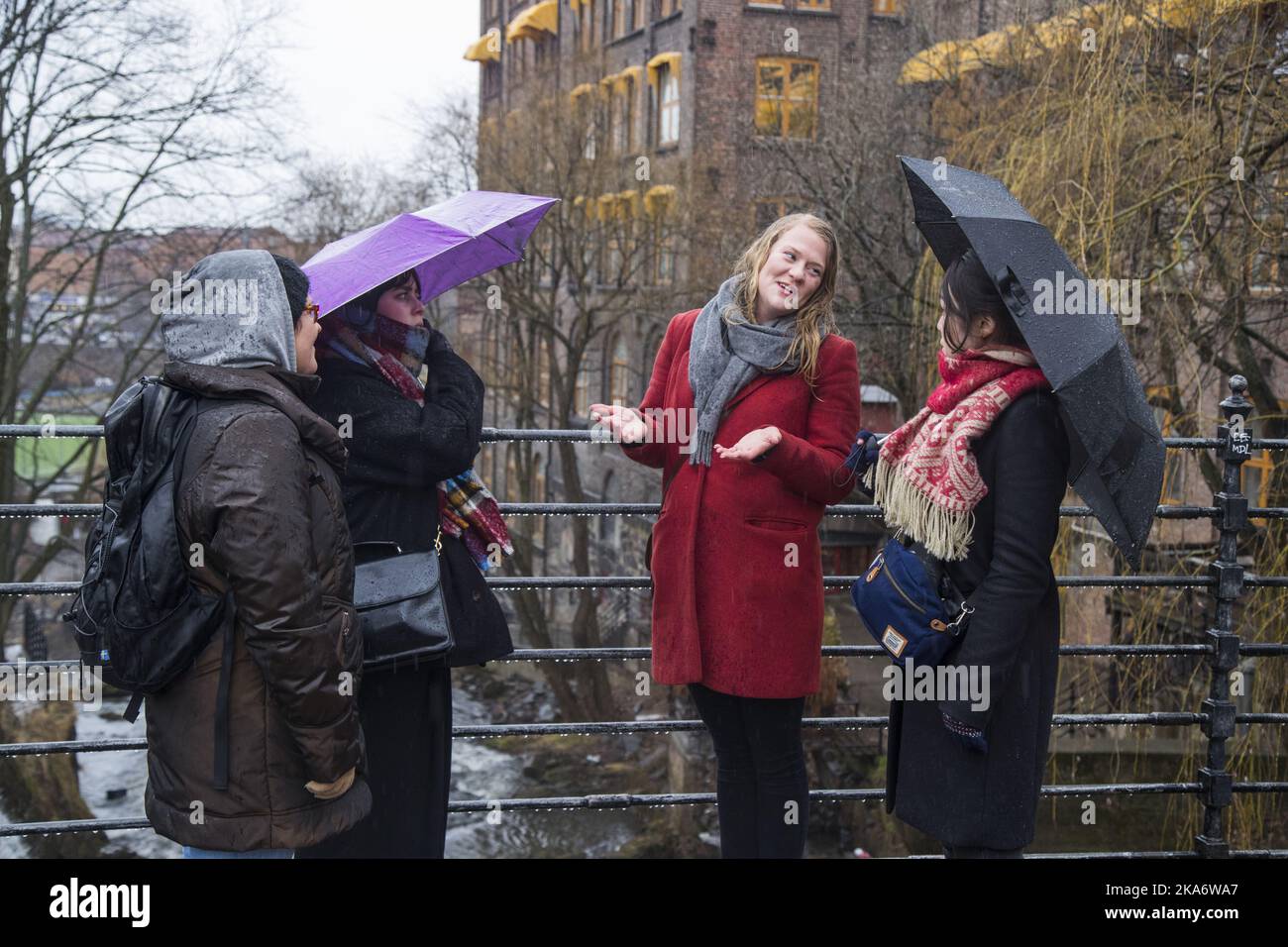 OSLO, Norway 20170330. SKAM-safari Guide Nina Soeraa tells SKAM-tourists Naoko Takayanagi (right) from Japan, Dorte Terkelsen and daughter Nanna, about the first kiss between Noora and William Beier on bridge in 'SKAM' (SHAME) Season Two. Photo: Heiko Junge / NTB scanpix Stock Photo