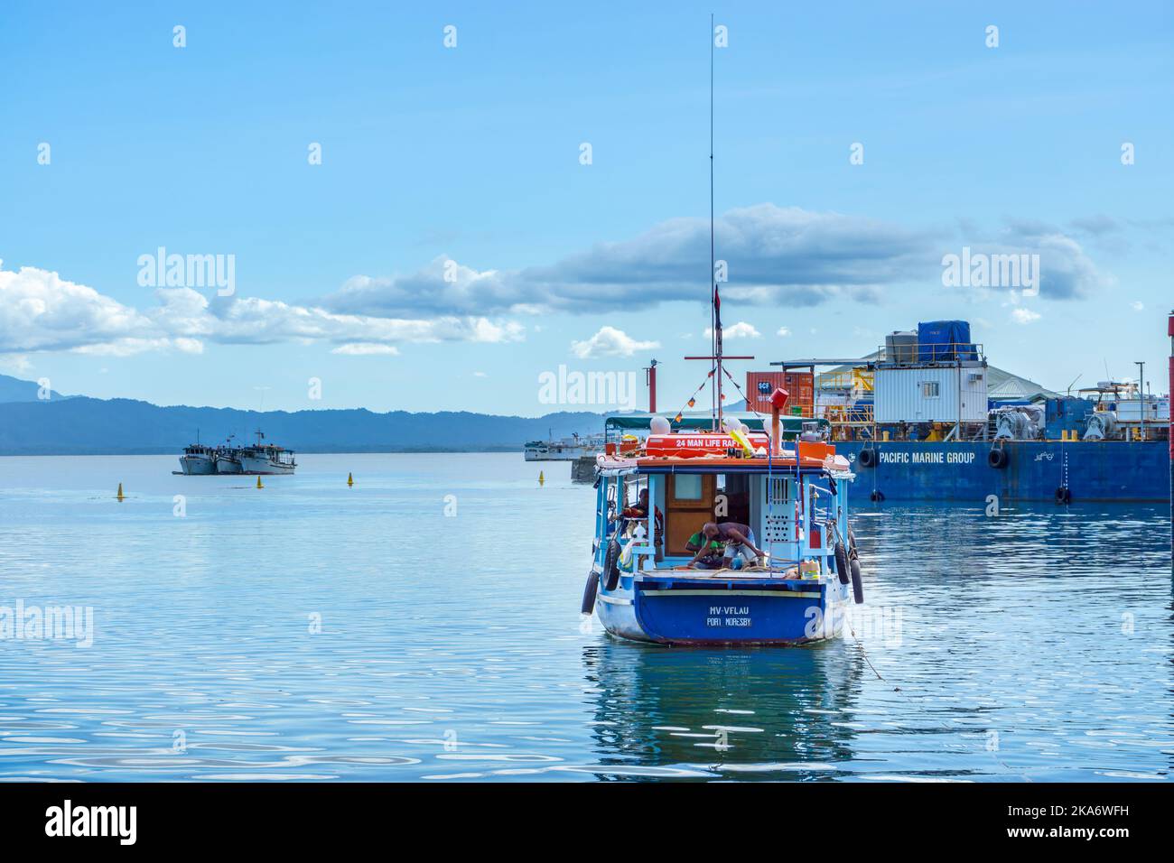 Boats anchored in marina Alotau, Milne Bay Papua New Guinea Stock Photo