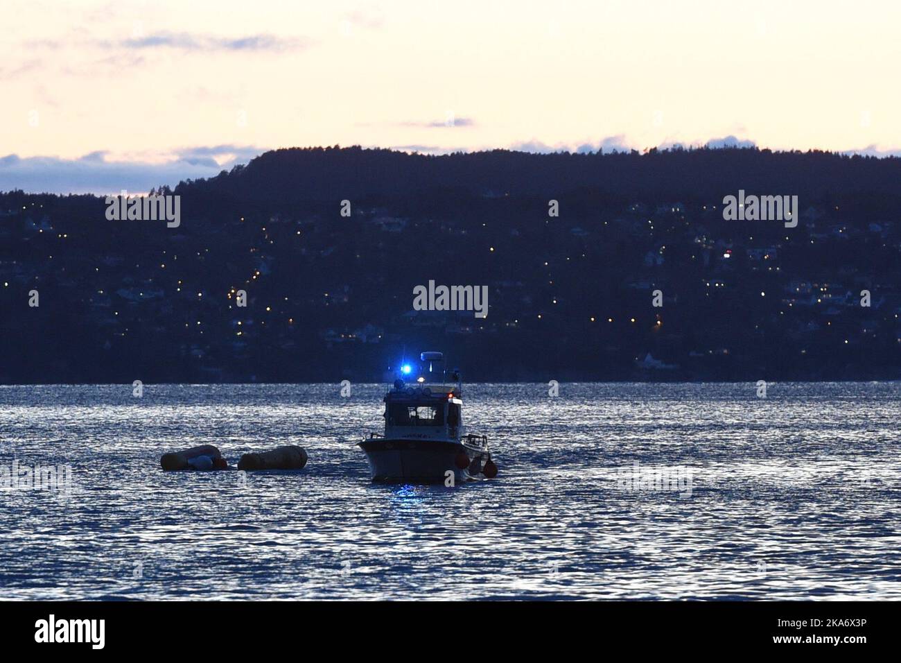 Dive teams search the water after a helicopter crashed during landing on the yacht Bacarella in Sandviken in Bergen. One is critically injured, two are more easily injured Stock Photo