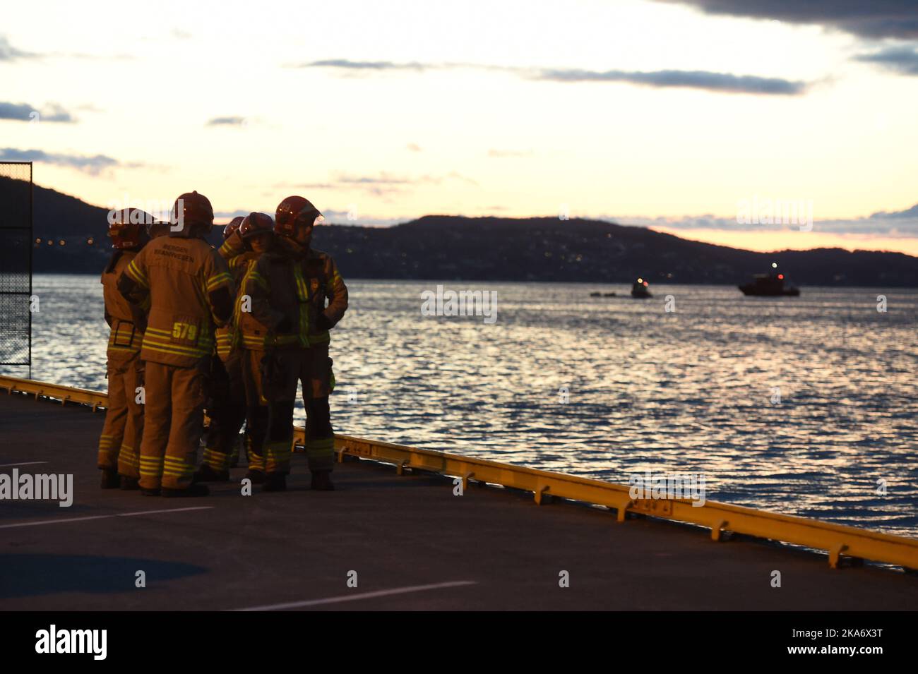 Recovery teams on the harbour after a helicopter crashed during landing on the yacht Bacarella in Sandviken in Bergen. One is critically injured, two are more easily injured Stock Photo