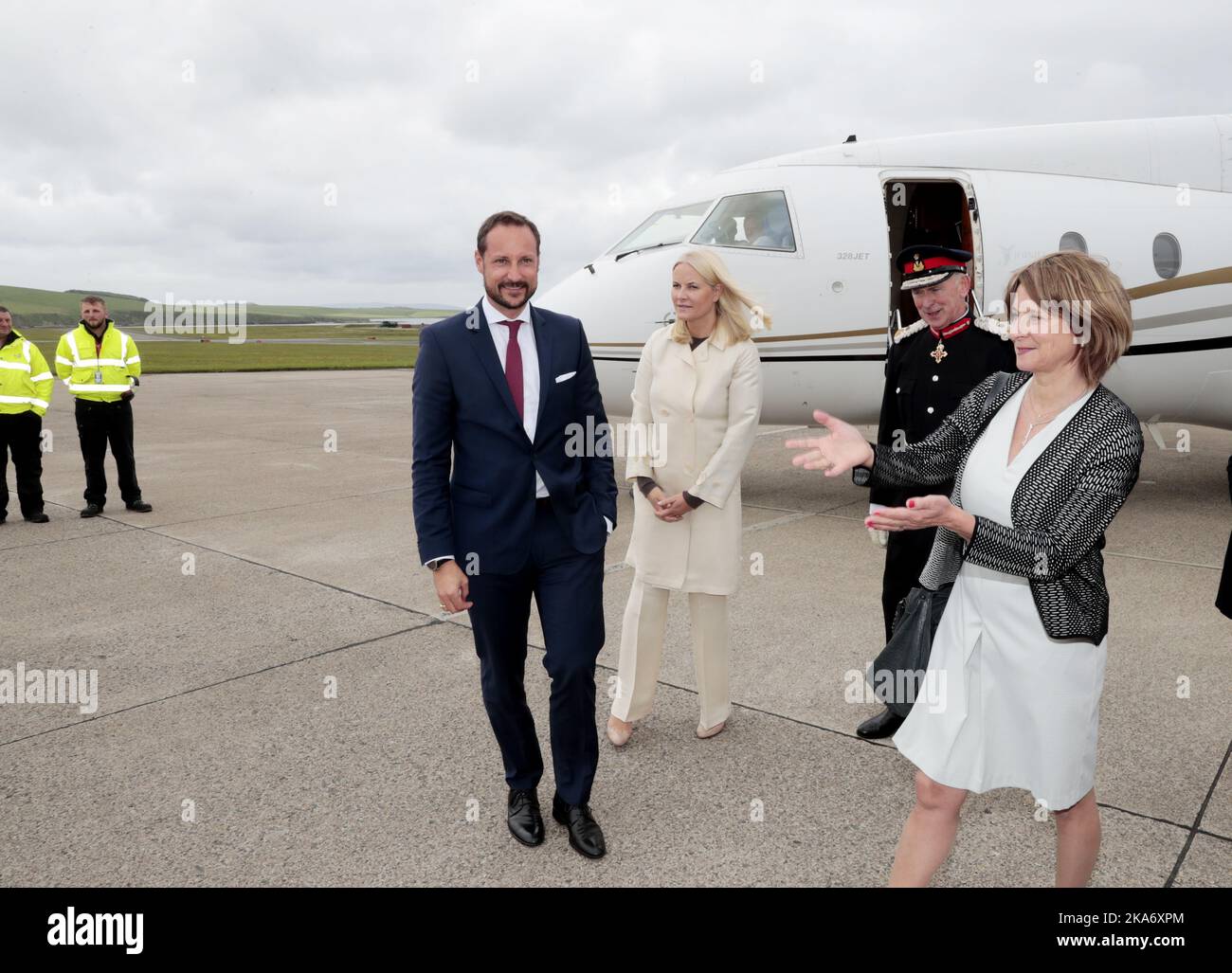 KIRKWALL, Great Britain 20170616. Crown Princess Mette-Marit and Crown Prince Haakon arrive at Kirkwall Airport on Orkney Islands on the occasion of the official visit in connection with the St. Magnus festival. Right: Ambassador Mona Juul. Photo: Lise Aaserud / NTB scanpix Stock Photo