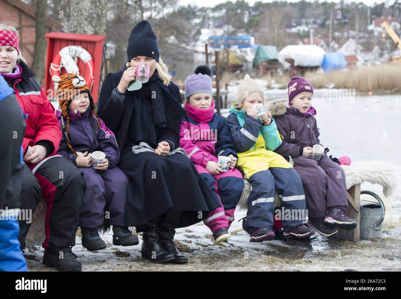 FREDRIKSTAD, Norway 20180215. Crown Princess Mette-Marit meets twelve kindergarten children from the Smertulia kindergarten and had ar mug of hot cocoa with them. Crown Princess Mette-Marit got a Moomin mug that she wanted to keep in her office. From left: Karoline, Marius, Crown Princess Mette-Marit, Lea, Andrea and Ylva Photo: Berit Roald / NTB scanpi Stock Photo