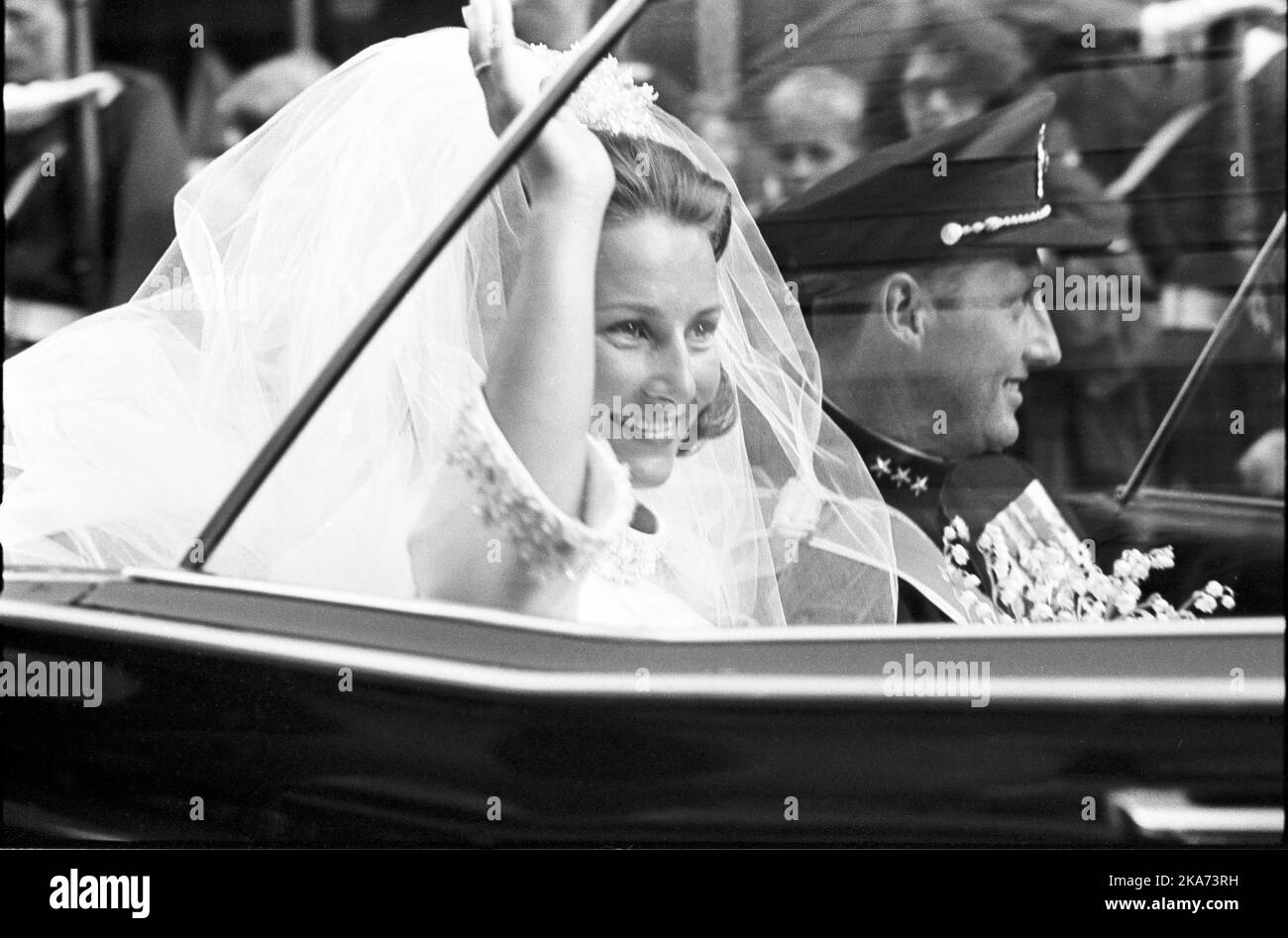 The bridal couple welcomed when they drove in an open car from Oslo Cathedral to the Palace after the wedding ceremony. Stock Photo