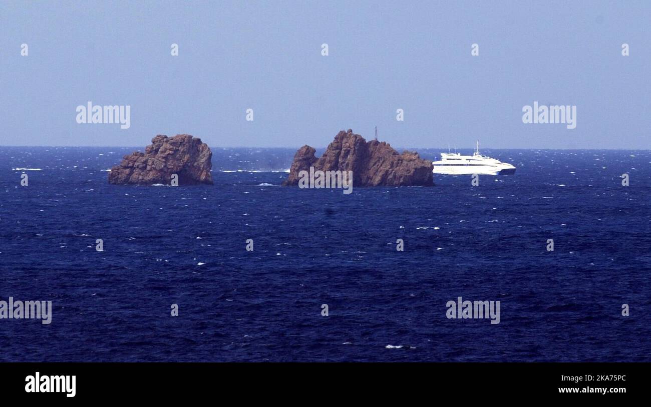 The Greek coast guard on the way out of the port of Paros with the skipper who is aiming for the grounding with Express Samina. Stock Photo