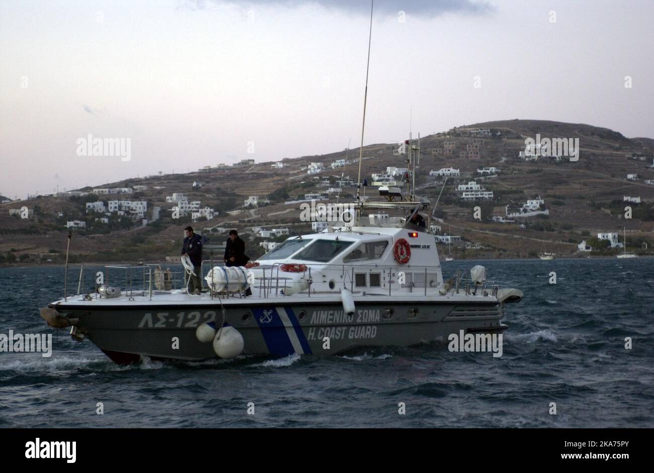 The Greek coast guard on the way out of the port of Paros with the skipper who is aiming for the grounding with Express Samina. Stock Photo