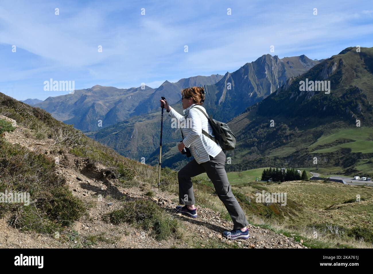 Woman walking on Col du Soulor in the pyrenees mountains bordering France and Spain Stock Photo