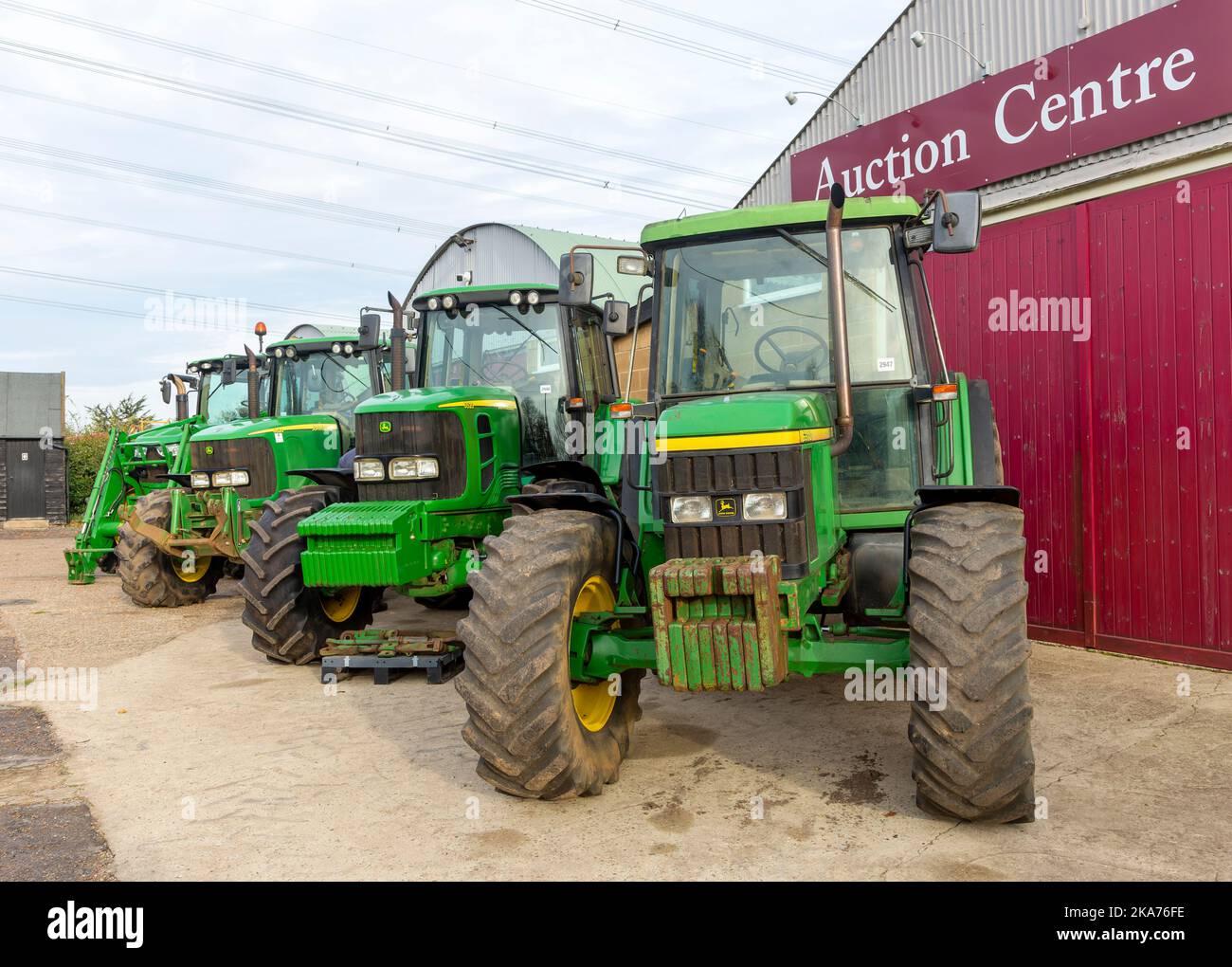 Row of John Deere tractors in farm machinery auction sale, Campsea Ashe