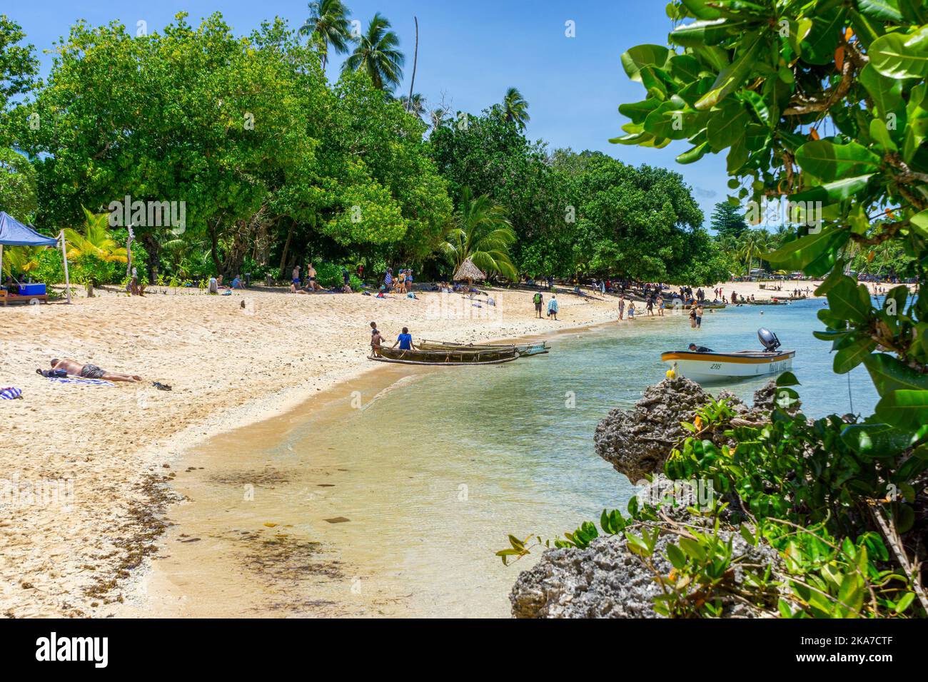 tropical beach with fringing coral reef and rock formations, Kiriwina