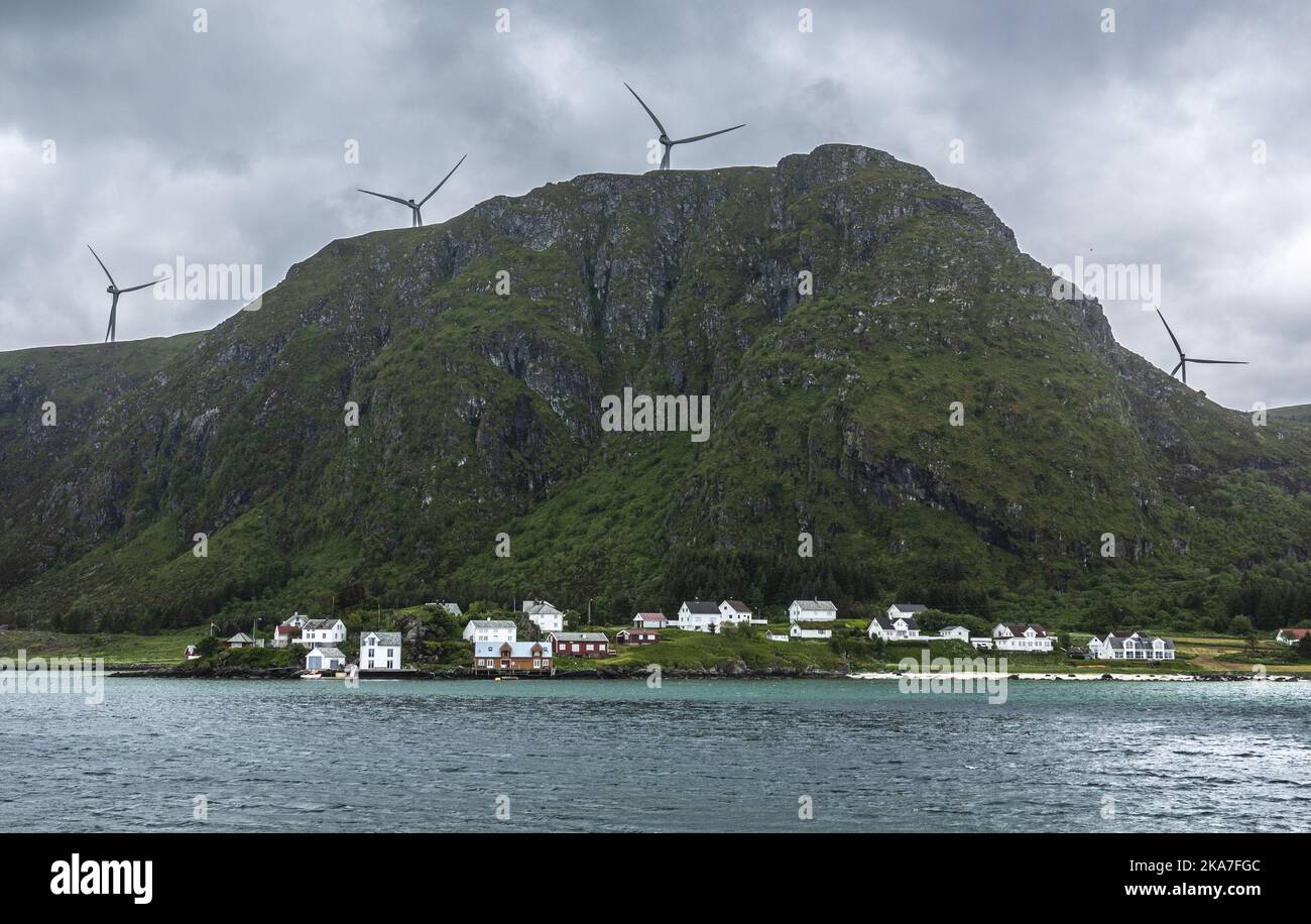 Haramsoeya 20220612 The village Ulla on Haramsoeya in Aalesund municipality in Moere og Romsdal. Wind turbines belonging to Haram wind farm on the mountain above Ulla. Photo: Halvard Alvik / NTB  Stock Photo
