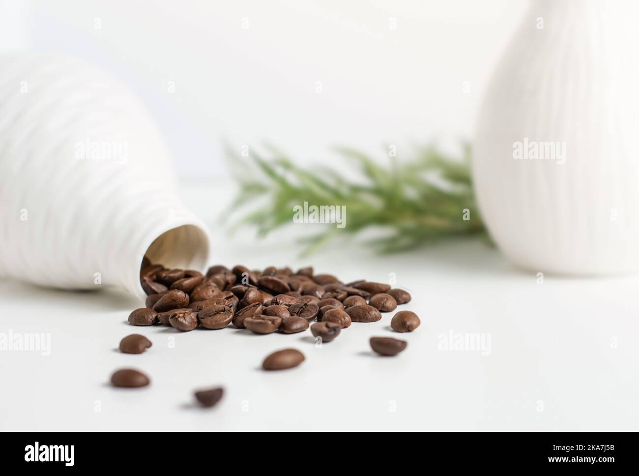 Spilled roasted arabica coffee beans on white background Stock Photo ...