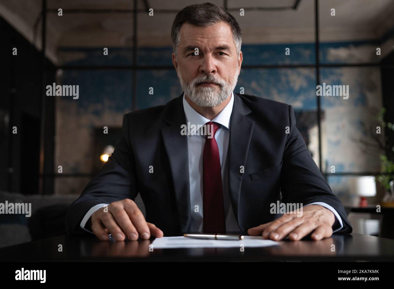 Portrait shot of executive senior businessman wearing suit and tie ...
