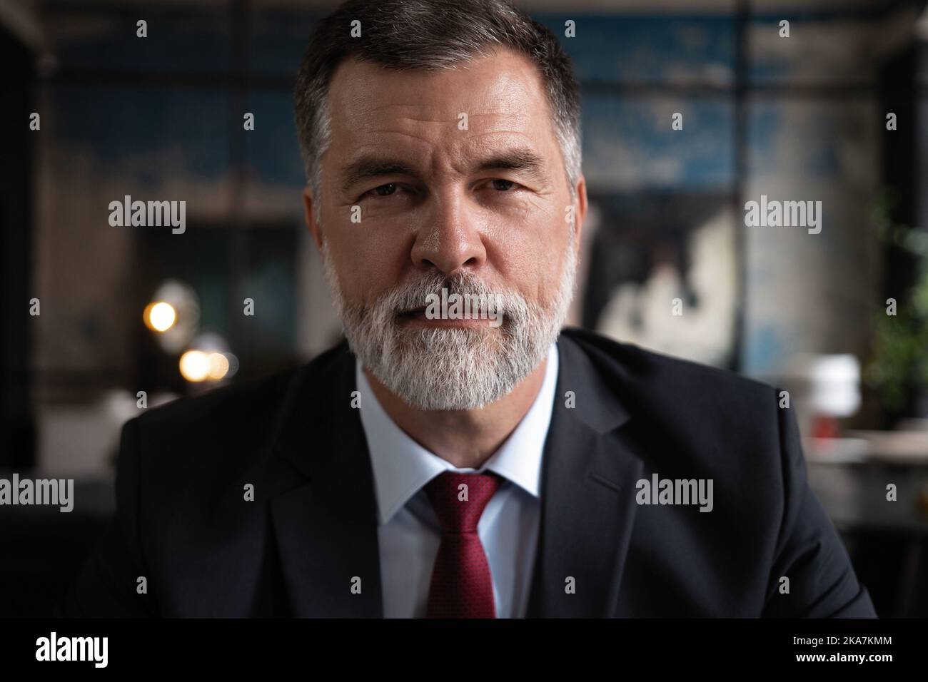 Portrait shot of executive senior businessman wearing suit and tie ...