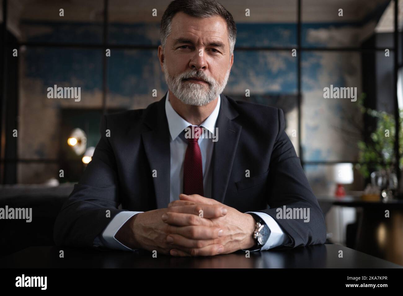 Portrait shot of executive senior businessman wearing suit and tie ...