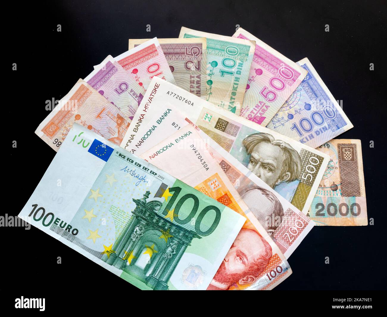 Croat Croatia banknotes of Croatian Dinars Kuna Kune Kunas and EU Euro Euros on Black background Stock Photo