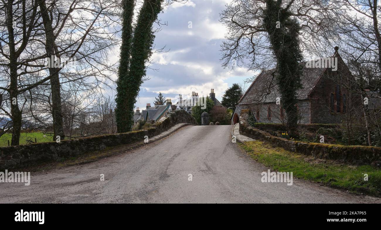 Skipness Church Framed by ivy covered trees, a view south across the bridge over the ...