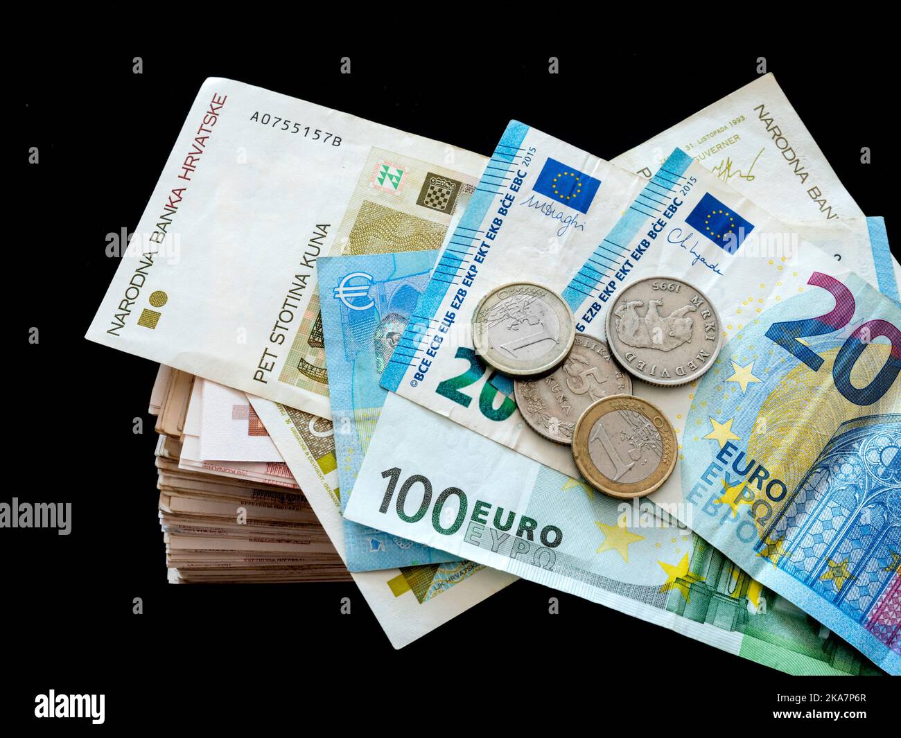 Bunch lot lots of Croat Croatia banknotes before conversion of Croatian Kuna Kune Kunas inot in EU Euro Euros on Black background Stock Photo