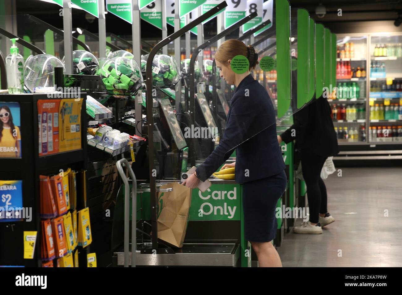 sydney-australia-1st-nov-2022-a-woman-uses-a-paper-shopping-bag-in
