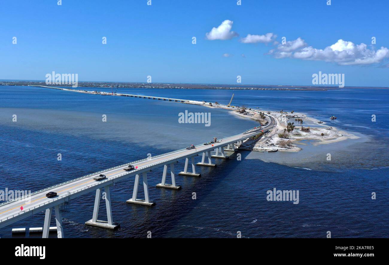 Fort Myers, United States. 31st Oct, 2022. (EDITORS NOTE: Image taken with drone)Cars are seen in this aerial view crossing the temporarily repaired Sanibel Island causeway which was impassable for about three weeks after Hurricane Ian destroyed two sections of the road after making landfall as a Category 4 hurricane. The storm caused an estimated $67 billion in insured losses and at least 127 storm-related deaths in Florida. Credit: SOPA Images Limited/Alamy Live News Stock Photo