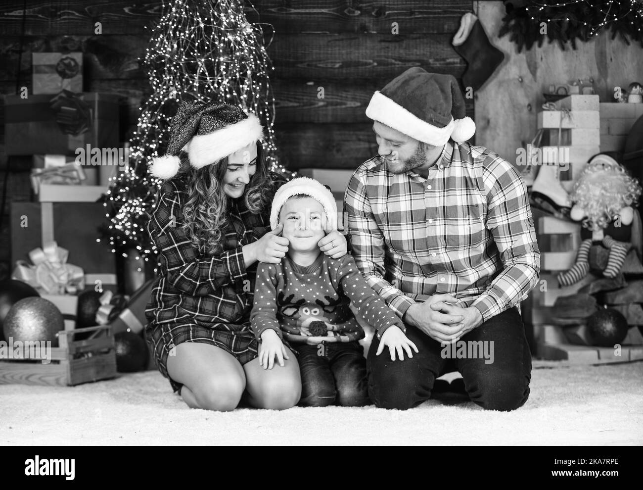 Winter holidays. Christmas tradition. Father mother little son