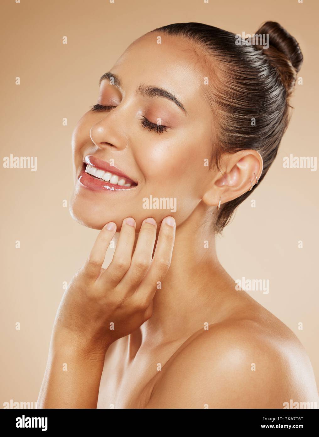 Natural, health and beauty woman with skincare feeling soft and beautiful face glow with hand. Healthy, body care and smile of girl satisfied with Stock Photo