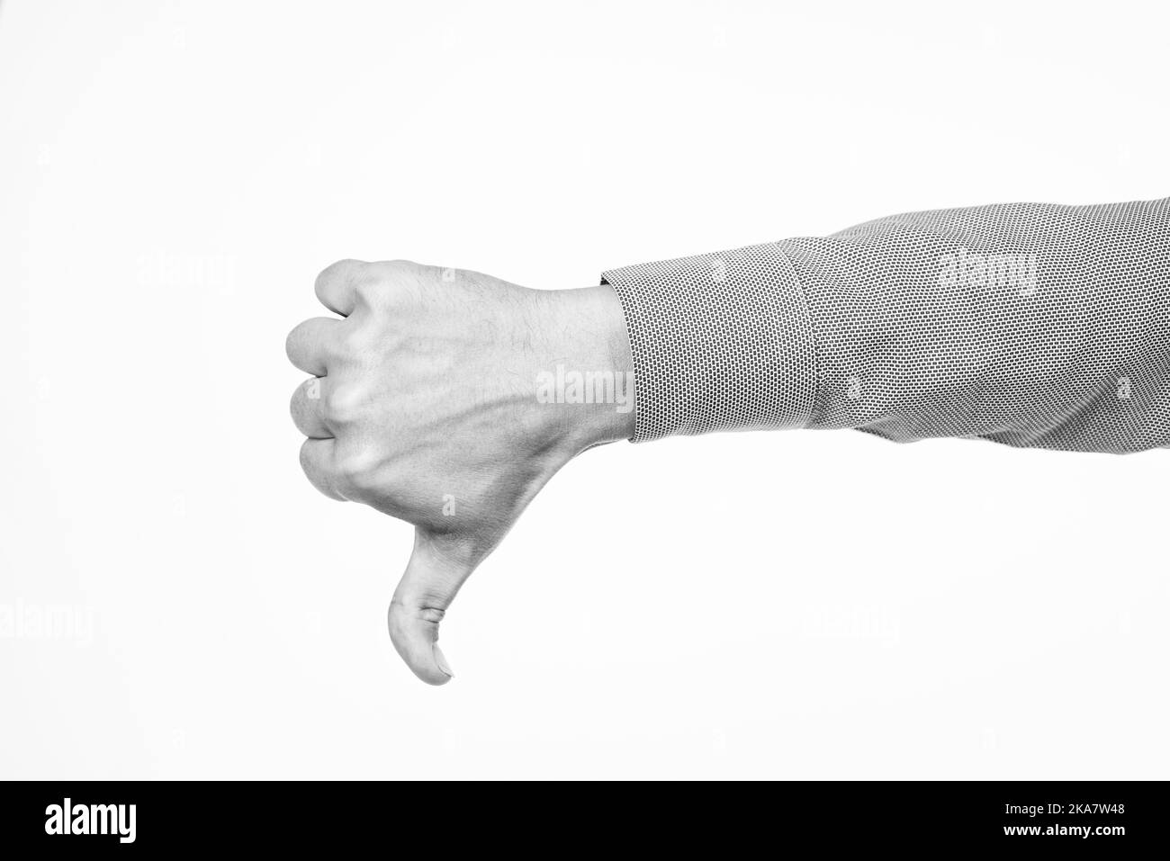 Thumbs down. dislike or unlike gesture. denote something bad. male hand with thumb down Stock