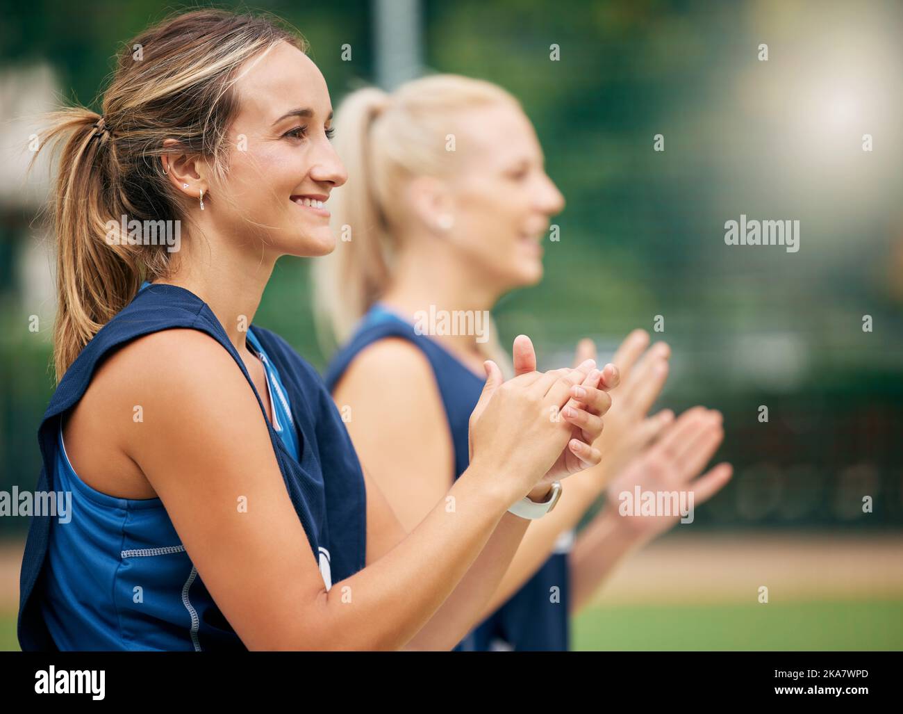 Success, applause and happy netball team in celebration for winning a sports game with teamwork and support. Smile, fitness and healthy women clapping Stock Photo