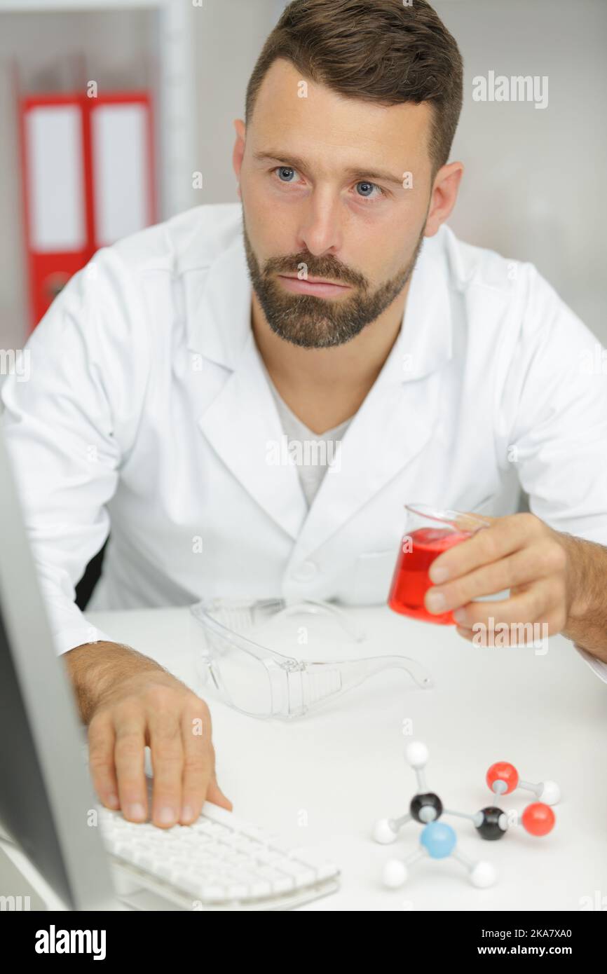 researcher with color liquid in test tubes Stock Photo - Alamy
