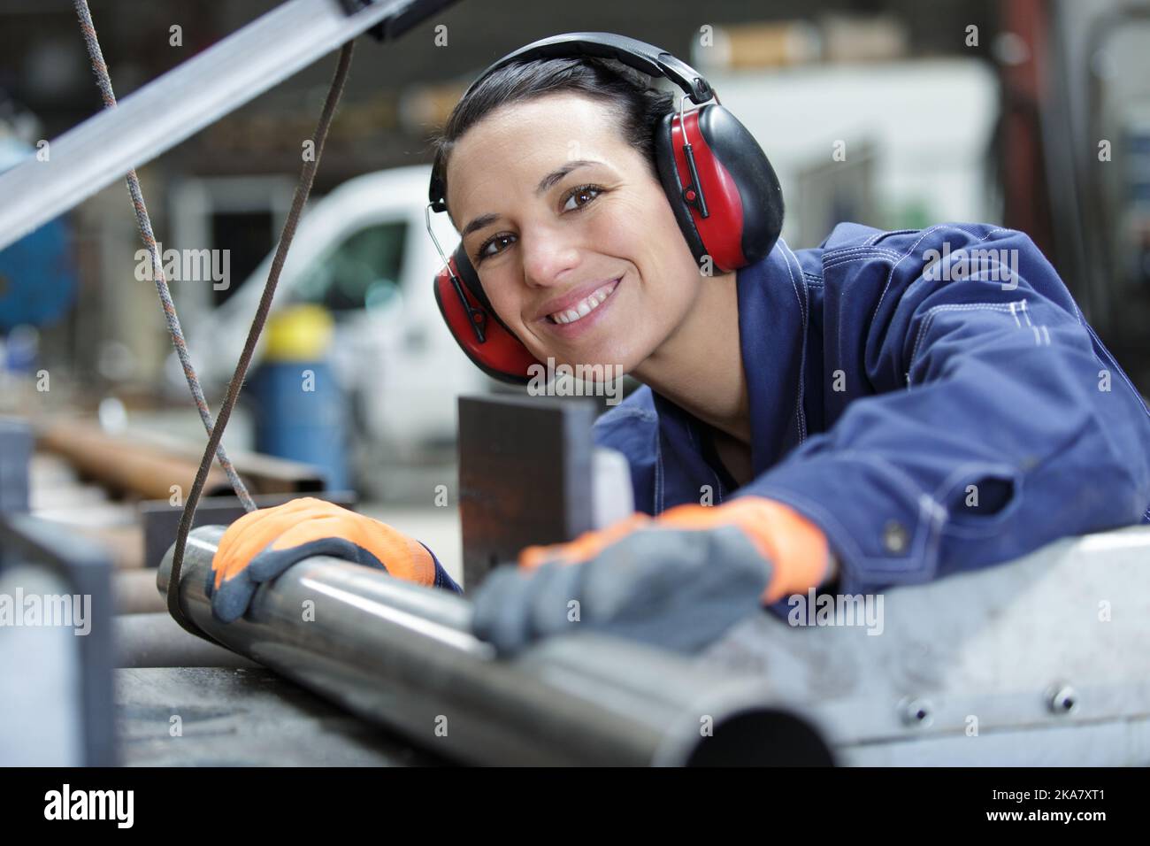 happy woman laborer is ready to cut pipes Stock Photo - Alamy
