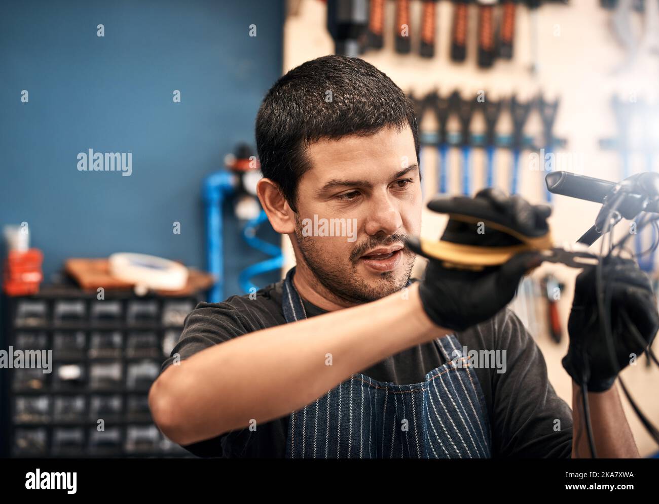 Bicycle repair how the pro does it. a man working in a bicycle repair