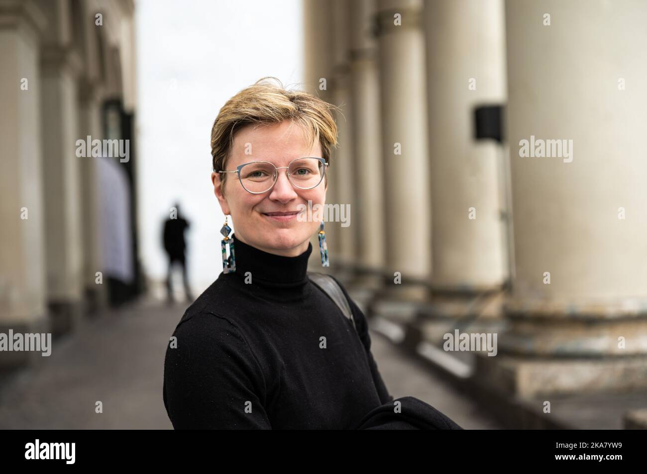 Outdoor portrait of a 36 yo short haired white woman wearing a black jersey, Belgium Stock Photo