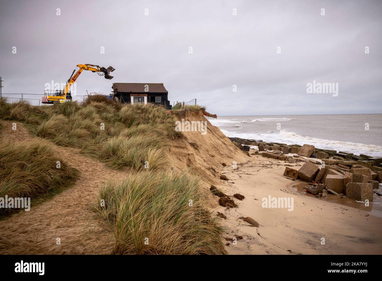 Dunes Cafe Demolition, Winteron-on-Sea, Norfolk, 4th December 2020  A cafe on the Norfolk coast was demolished today after high tides finally eroded the beach at Winterton-on-Sea near Gt Yarmouth, where the land owners had spent many years and 10's of thousands of pounds attempting to halt the erosion. The Dunes cafe, popular with coastal walkers and seal-watchers was opened in the early 1970's  Photography  by Jason Bye t: 07966 173 930 e: mail@jasonbye.com w: www.jasonbye.com Stock Photo