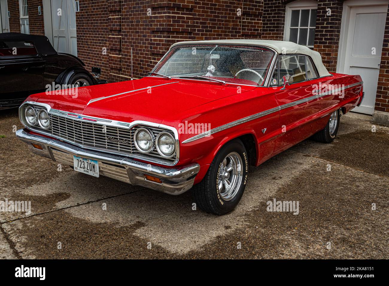 Des Moines, IA - July 01, 2022: High perspective front corner view of a 1964 Chevrolet Impala SS Convertible at a local car show. Stock Photo