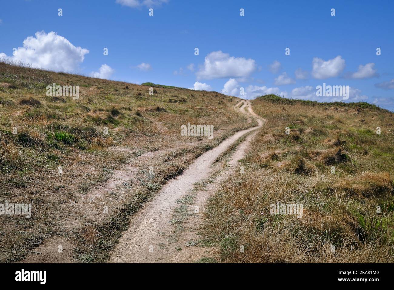 A rough eroded footpath on The Warren on Pentire Point East in Newquay in Cornwall in the UK. Stock Photo