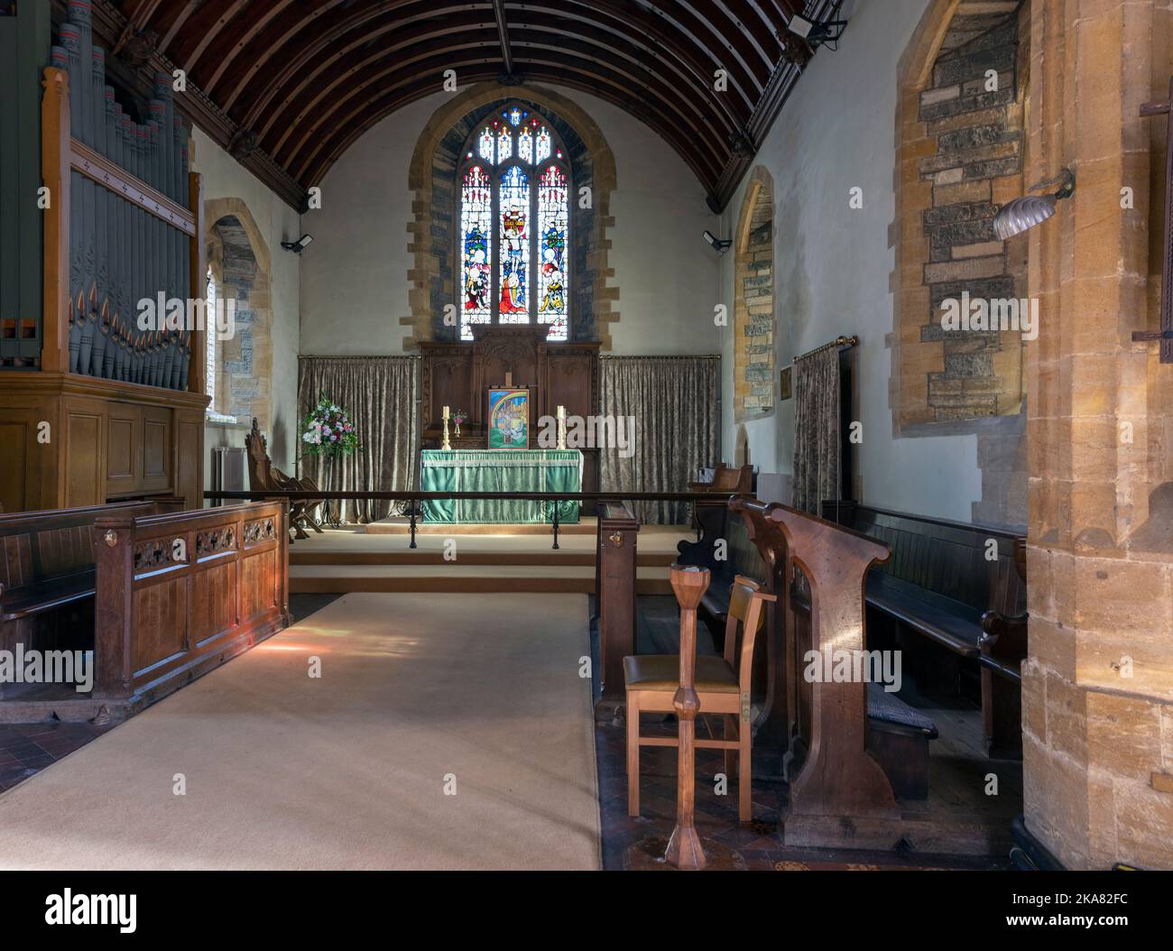 St Mary's Church, Huish Episcopi, Somerset, England, UK - grade I listed building - interior view of aisle and altar Stock Photo
