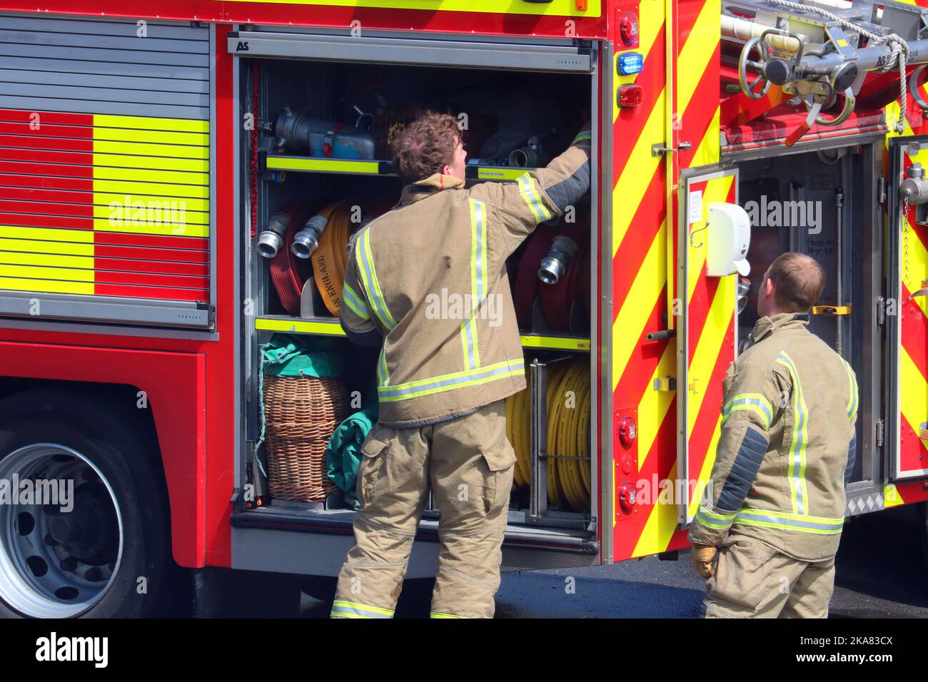Firemen attending a a small fire in Bedfordshire, United, Kingdom. Stock Photo