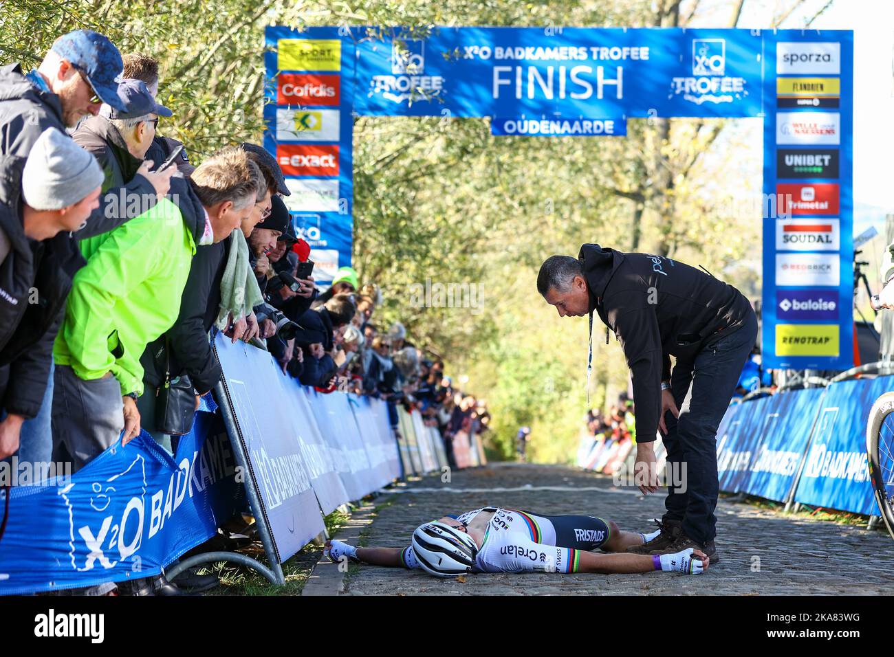 Belgian Joran Wyseure lies on the ground after the finish of the U23