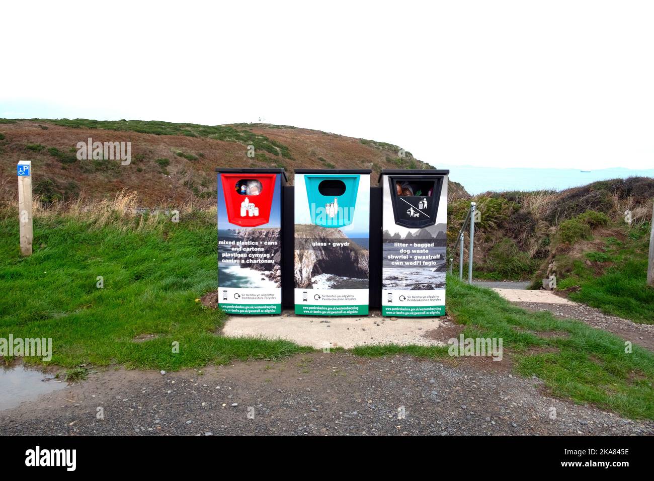 Welsh English bilingual recycling bins in the countryside on the