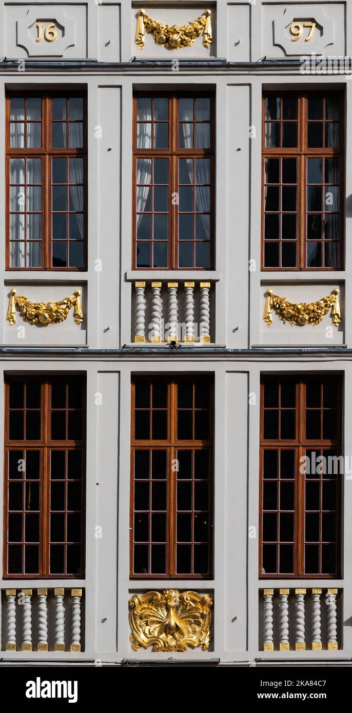 Brussels Old Town, Belgium - 10 28 2022 - Ornamented and gold plated design of the windows of the guild houses at Grand Place Stock Photo