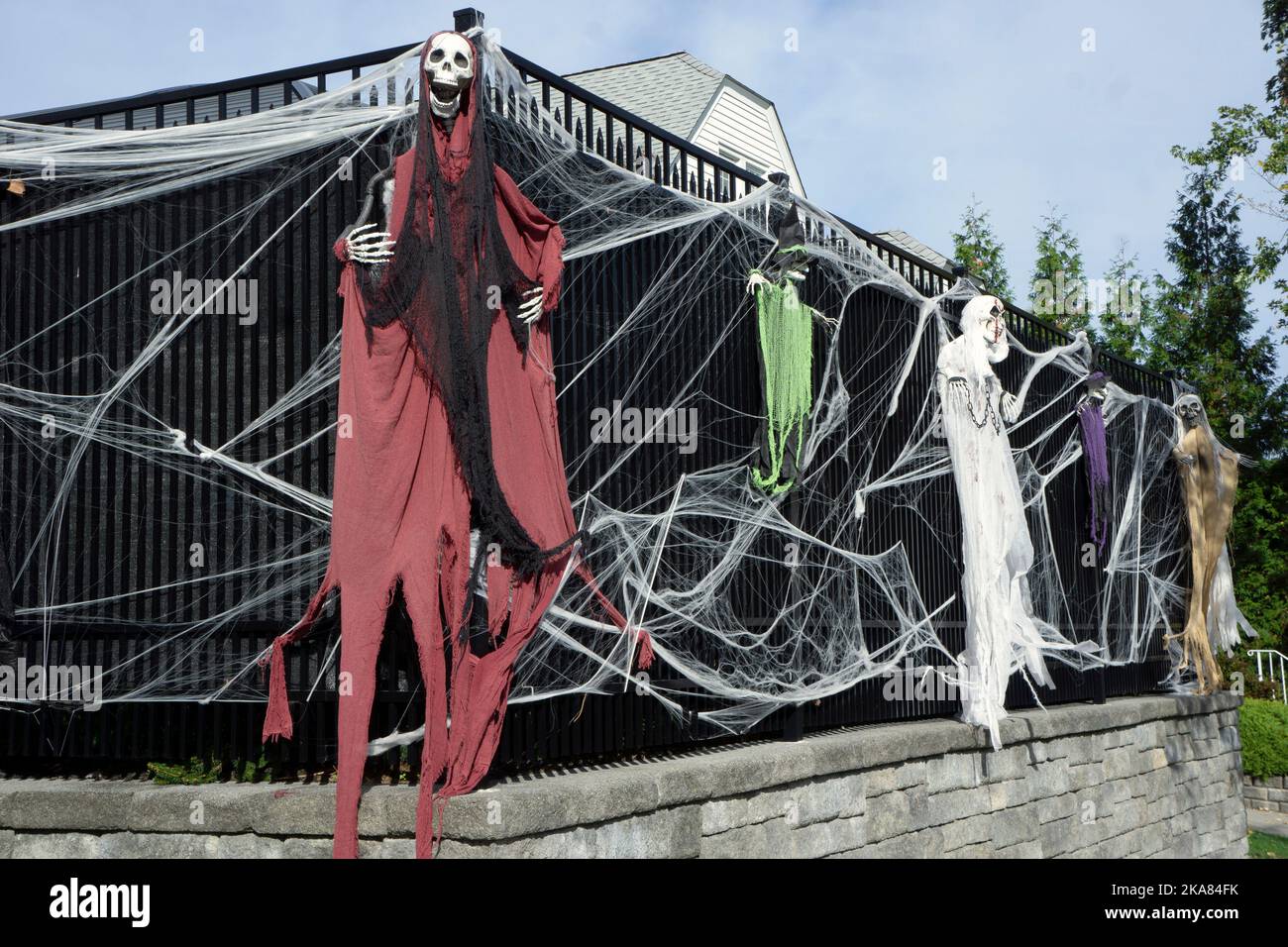 GHOSTS & SPIDER WEBS. Halloween decorations at a private home in