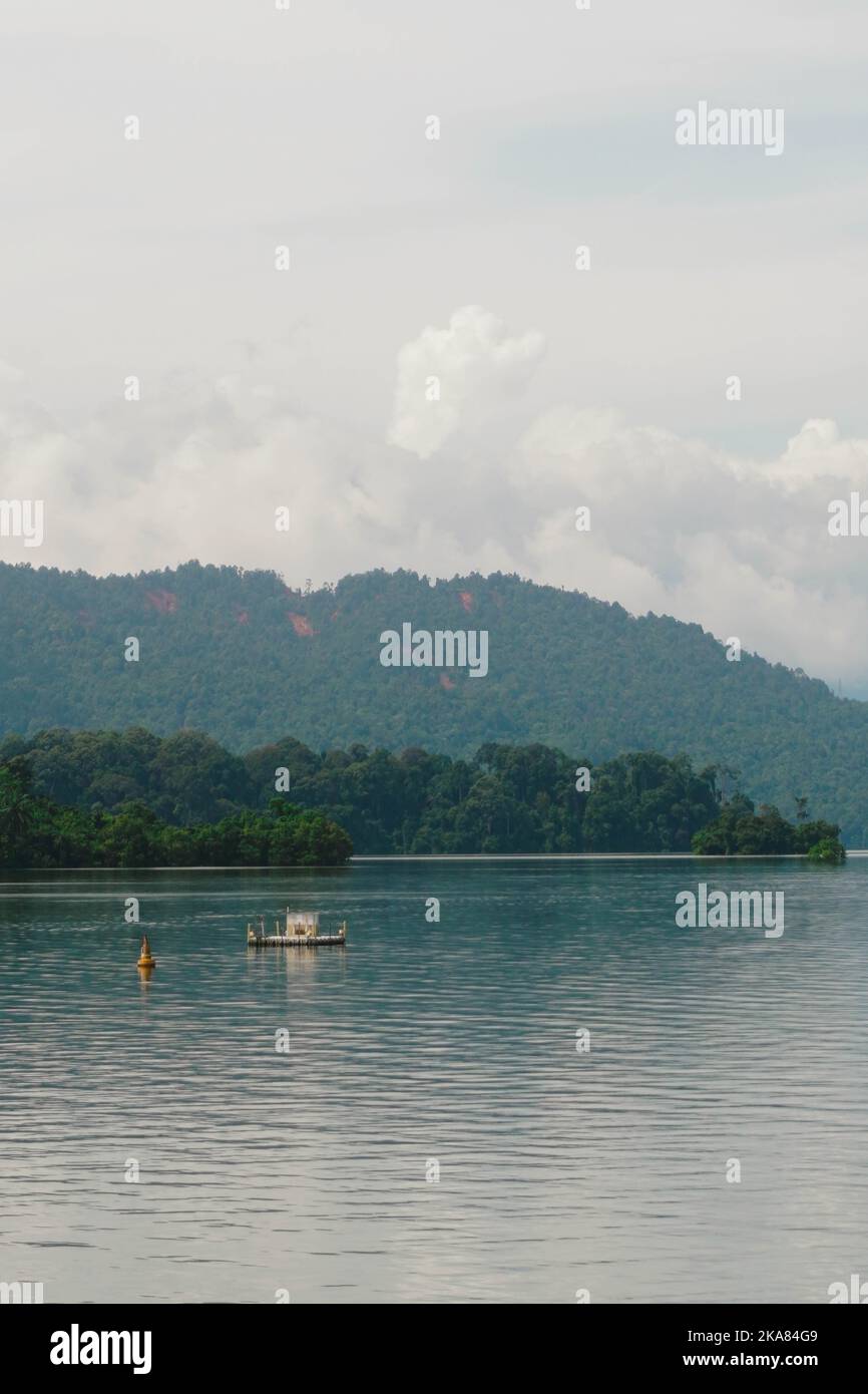 A photo in the vast Tasik Kenyir Lake in Terengganu, Malaysia which also happens to be the biggest manmade lake in the southeast Asia. Stock Photo