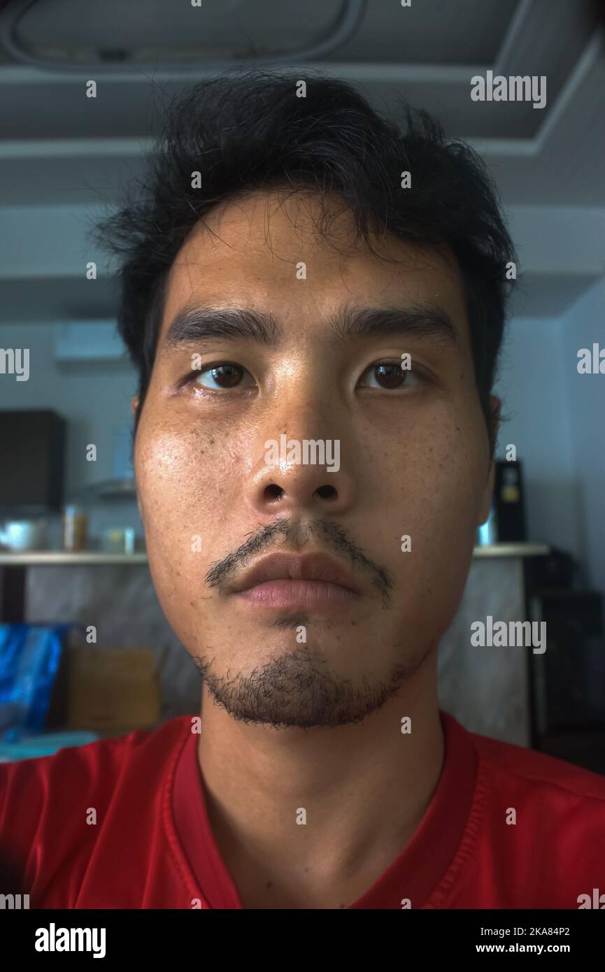  A 29-year-old Asian man with serious face Stock Photo - Alamy