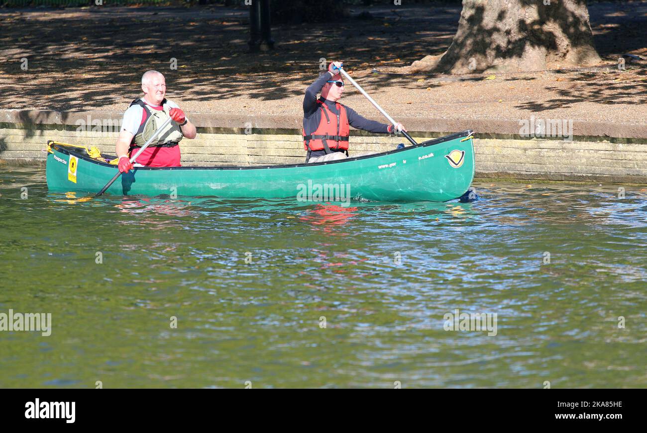Two people paddling a canoe on the river Great Ouse in the United
