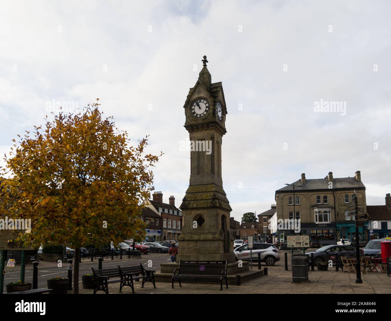 Clock Tower in Thirsk Market Place centre of North Yorkshire Market town England UK looking towards Bianco Restaurant town depicted as Darrowby Stock Photo