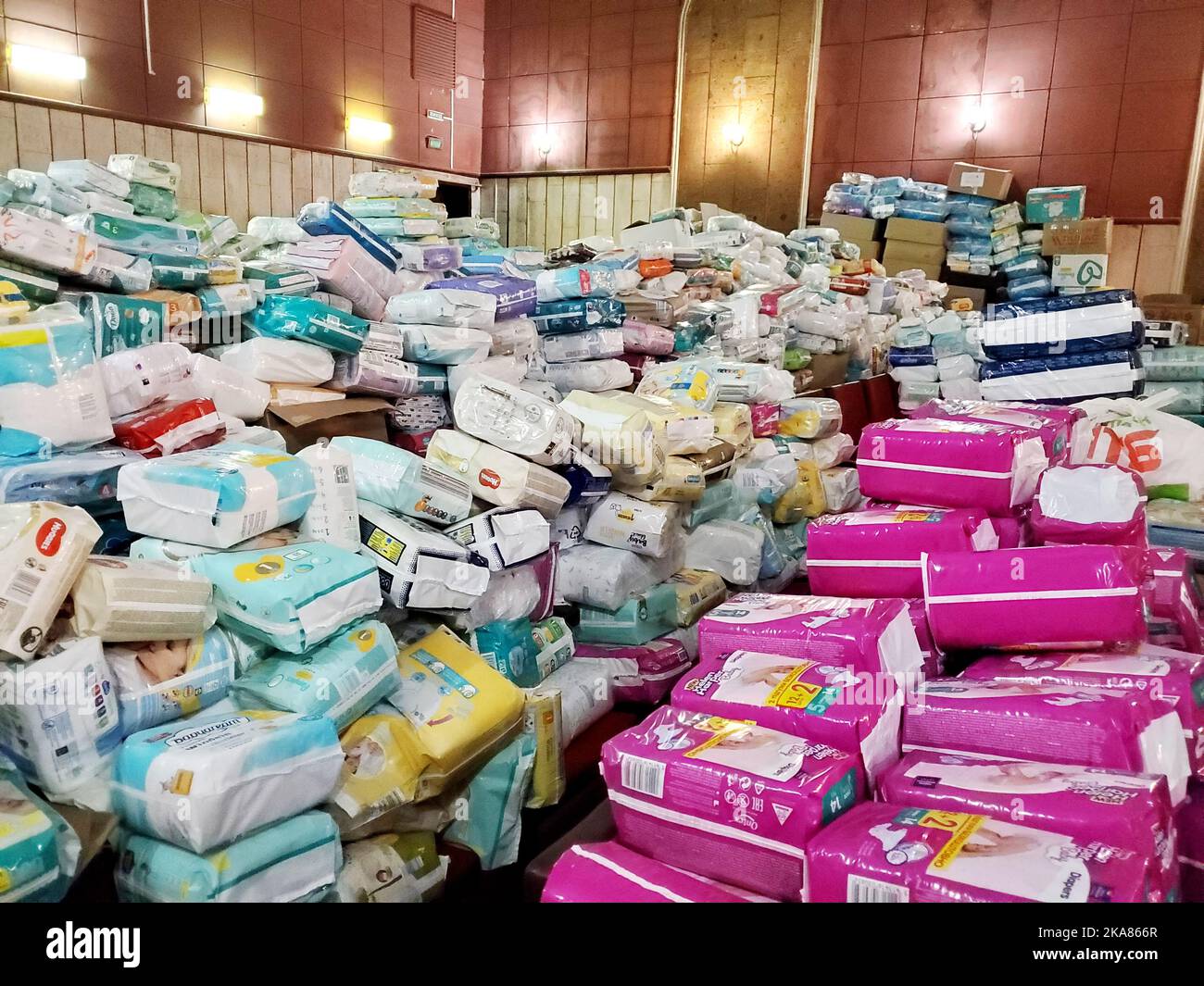 Pile of diapers and other diapers in the warehouse of the volunteer