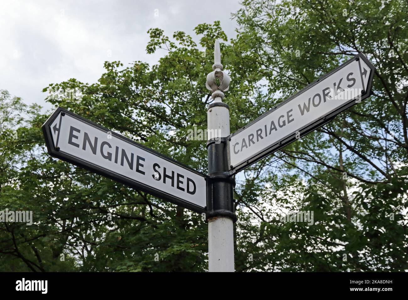 Signpost showing direction of Engine Shed and Carriage Works, Ingrow West railway station on Keighley & Worth Valley Railway Stock Photo