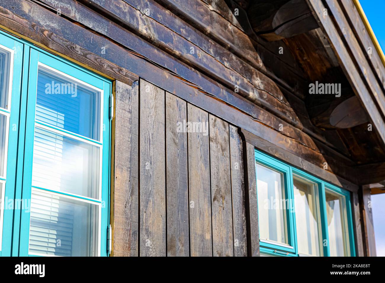 The facade of a wooden house with glass windows Stock Photo - Alamy