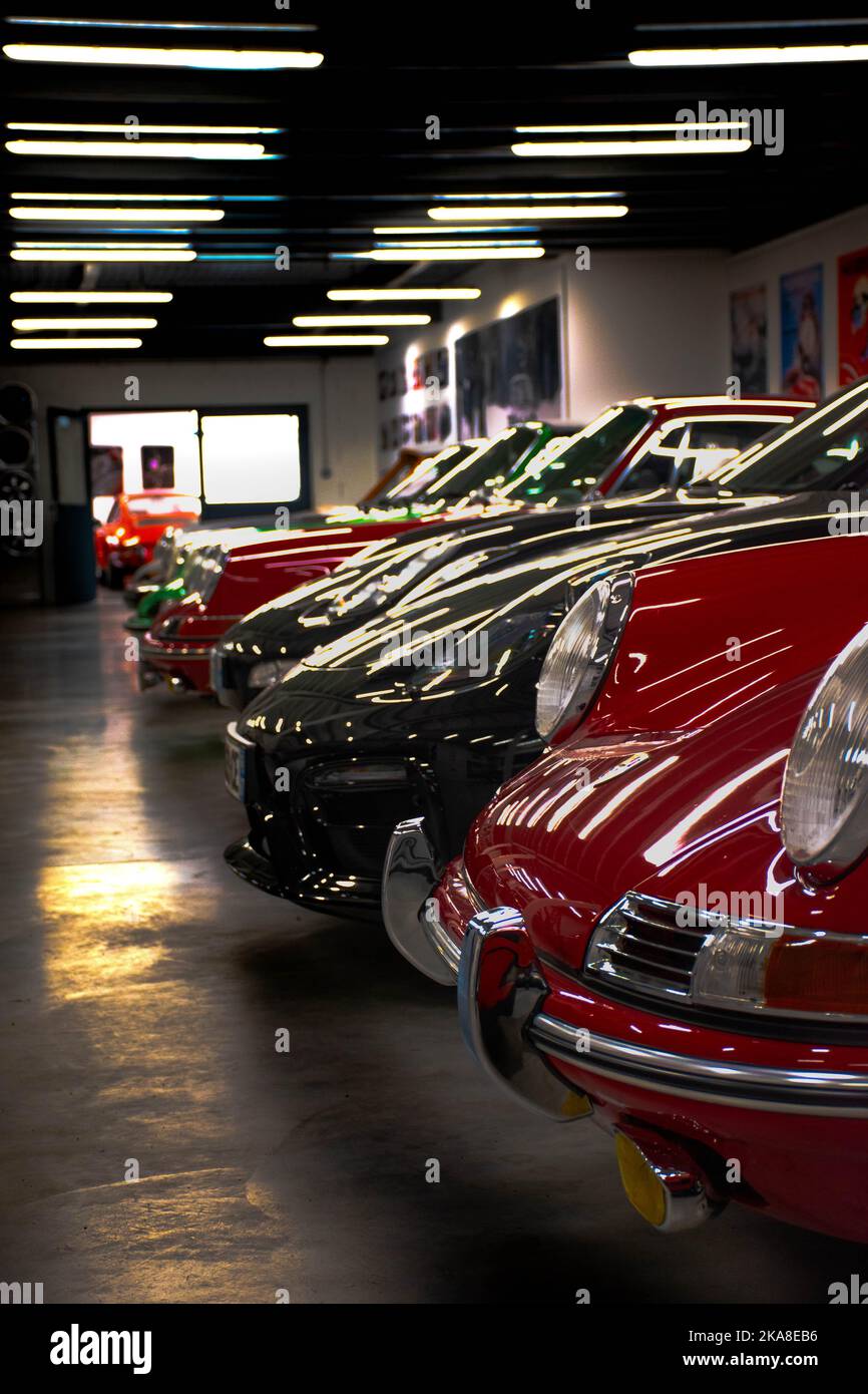 A vertical shot of the beautiful cars on display. Line of Porsche 911